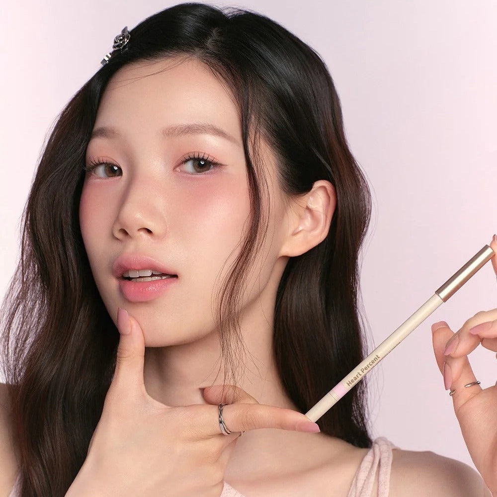 Model showcasing the HEART PERCENT Dot On Mood Gel Eyeliner Pencil with a soft makeup look, highlighting its precision and style.