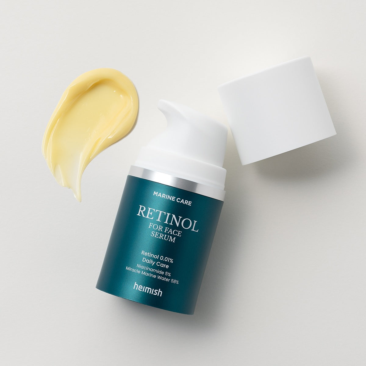 HEIMISH Marine Care Retinol For Face Serum 50ml bottle with a swatch of cream on a light background