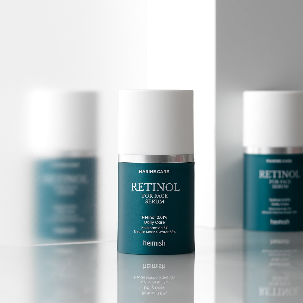 HEIMISH Marine Care Retinol For Face Serum 50ml bottle on display with reflection on a glass surface