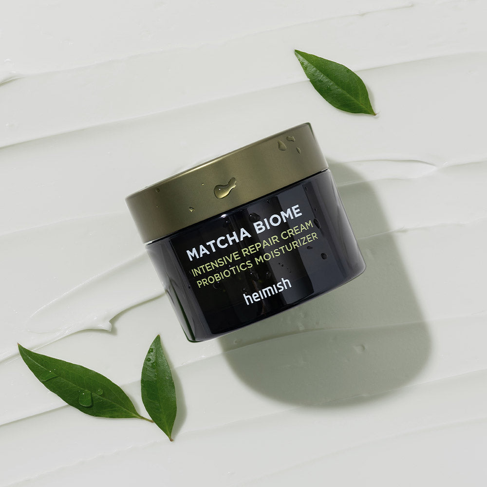 HEIMISH Matcha Biome Intensive Repair Cream 50ml jar with green leaves on textured background