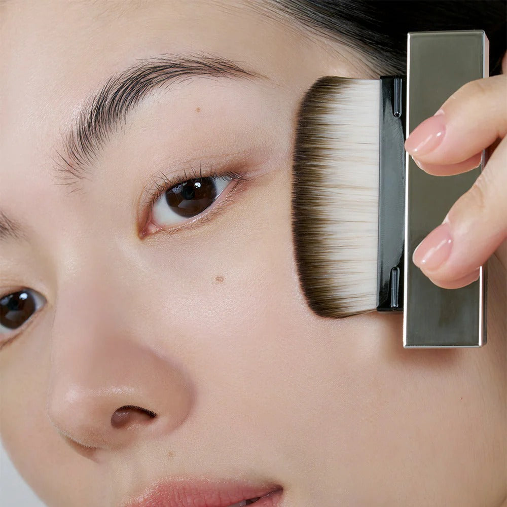 Applying HERA Airy Powder Primer 8.5g for flawless skin finish