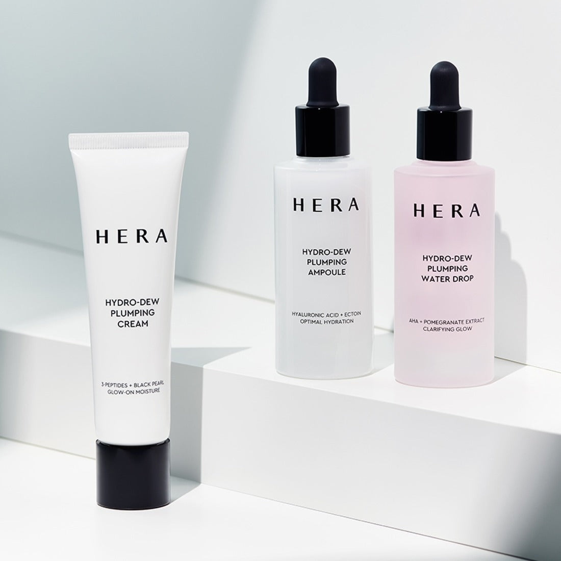 HERA Hydro-Dew Pluming Water Drop 50ml with ampoule and cream on display