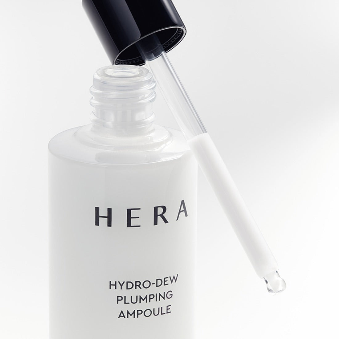 HERA Hydro-Dew Plumping Ampoule 50ml with dropper for intense hydration and plumping effect.