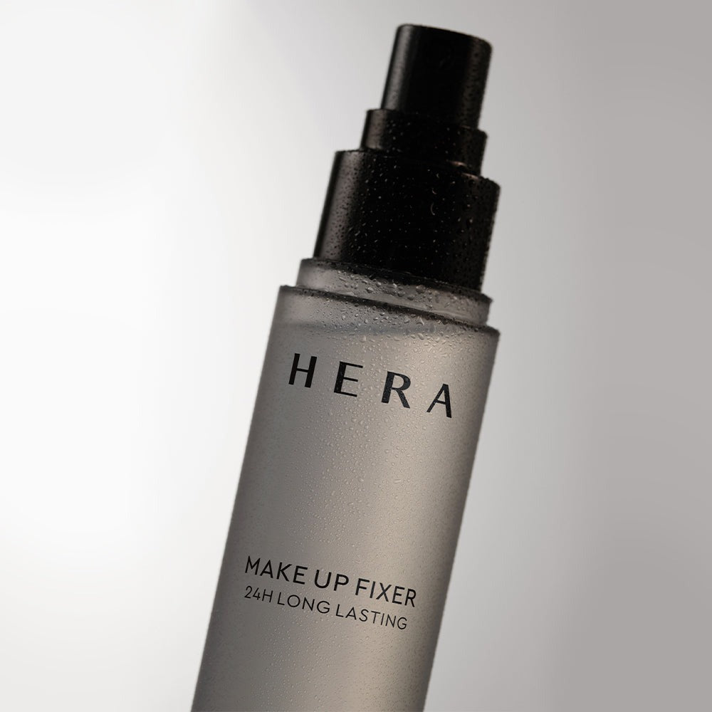 HERA Make Up Fixer 80ml in sleek bottle design for long-lasting makeup setting.