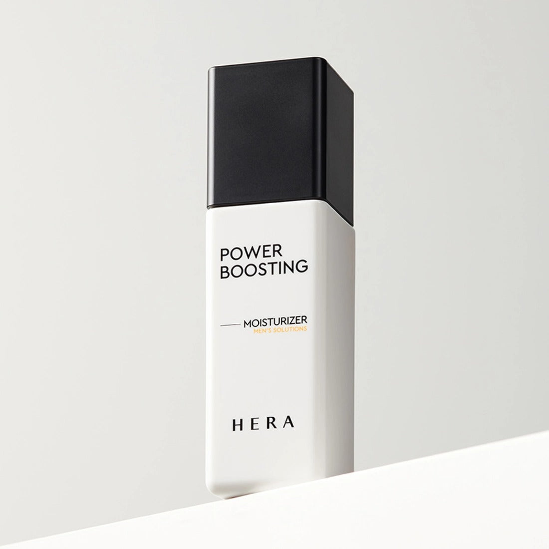 HERA Powder Boosting Moisturzer 110ml sleek bottle design on a minimalist background