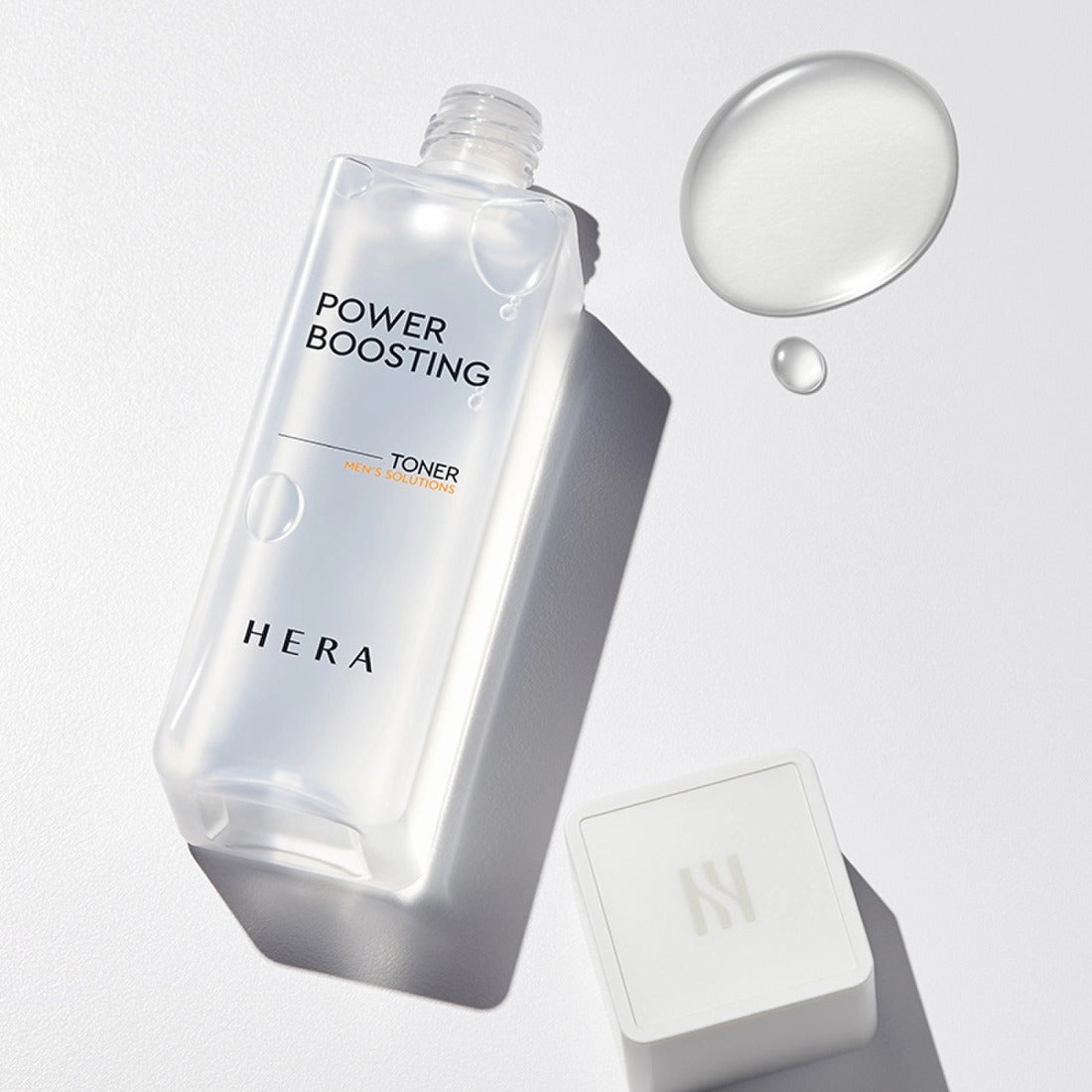 HERA Power Boosting Toner 150ml bottle with a clear liquid drop and a white cap.