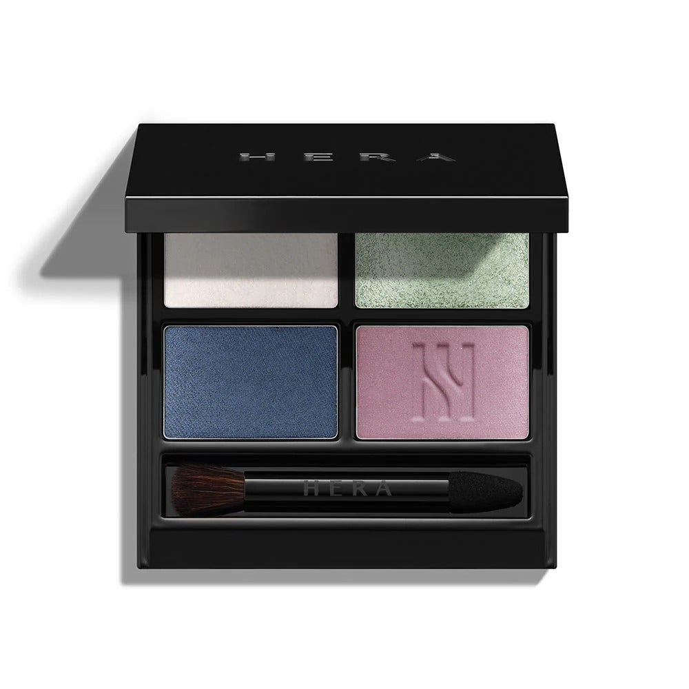 HERA Quad Eye Color palette with four vibrant eyeshadow shades and applicator brush, perfect for versatile eye makeup looks.