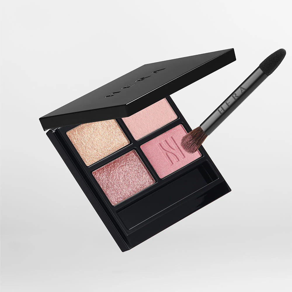 HERA Quad Eye Color featuring shimmering eyeshadow palette with four shades and brush.