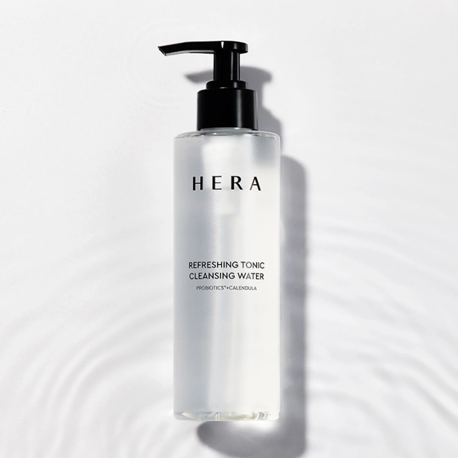 HERA Refreshing Tonic Cleansing Water 200ml bottle on a white background, highlighting skincare benefits.