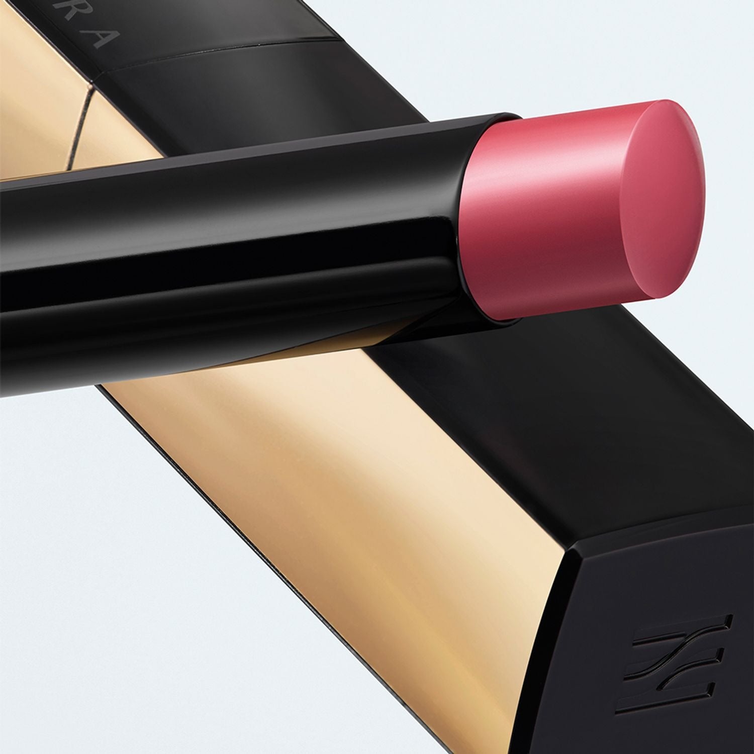 Close-up of HERA Rouge Clasyy 3.5g lipstick with elegant black and gold packaging.