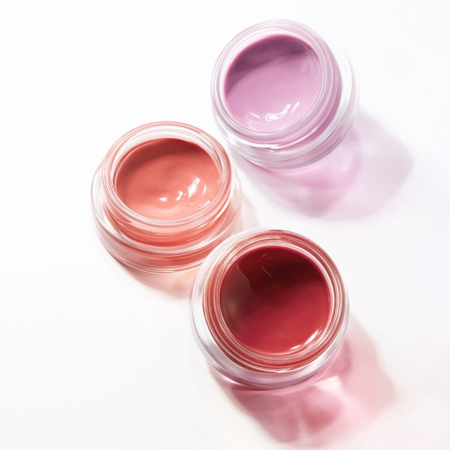 HERA Sensual Lip & Cheek 7g in various shades for vibrant lips and cheeks, beautifully showcased in clear jars.