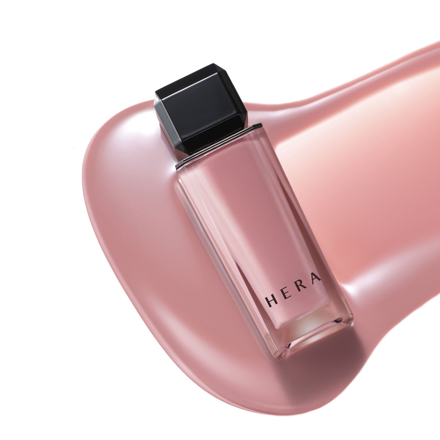 HERA Sensual Nude Gloss 5g bottle on a glossy surface showcasing its luxurious design and elegant packaging.