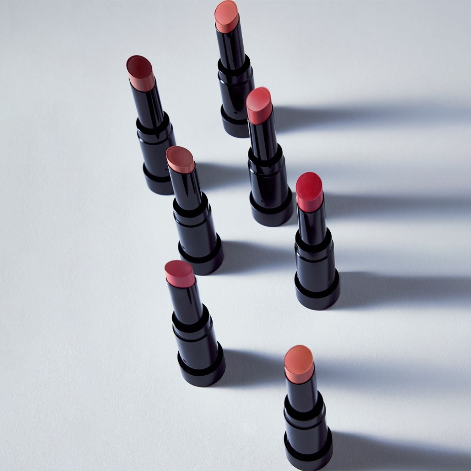 Diverse shades of HERA Sensual Powder Matte Lipstick 3g elegantly displayed, showcasing premium matte finish options for every style.