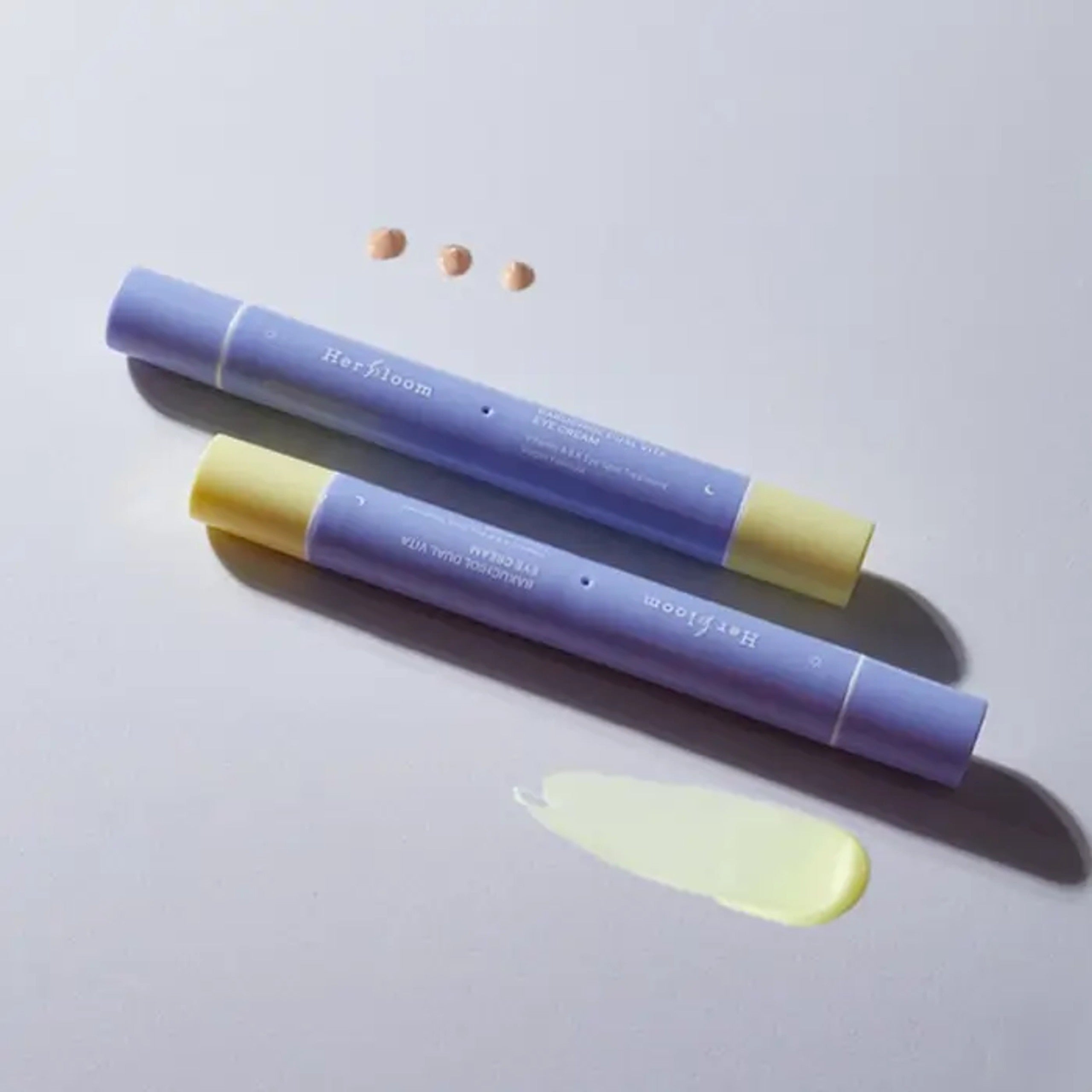 HERBLOOM Bakuchiol Dual Vita Eye Cream tubes on light background