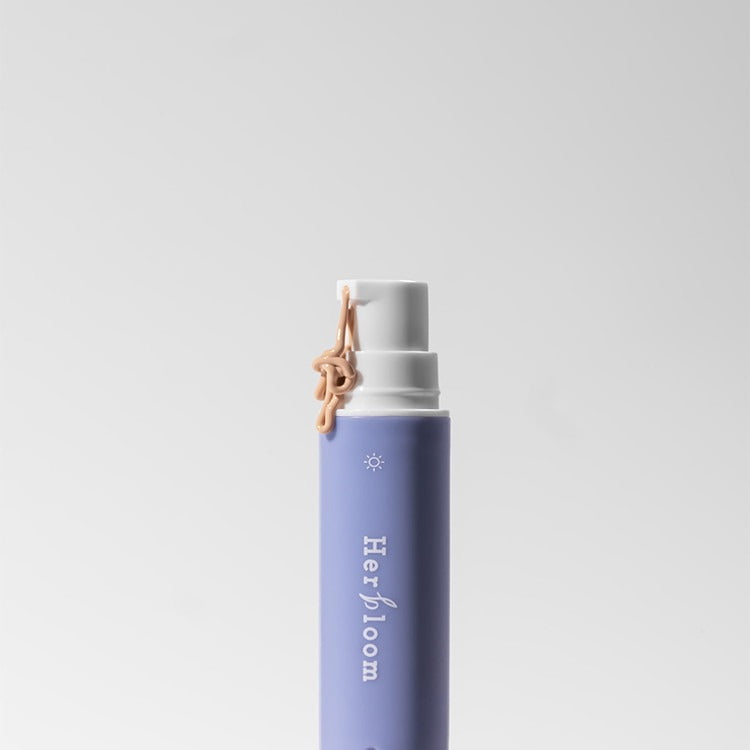 HERBLOOM Bakuchiol Dual Vita Eye Cream in a sleek purple bottle with pump dispenser, ideal for skincare routine.