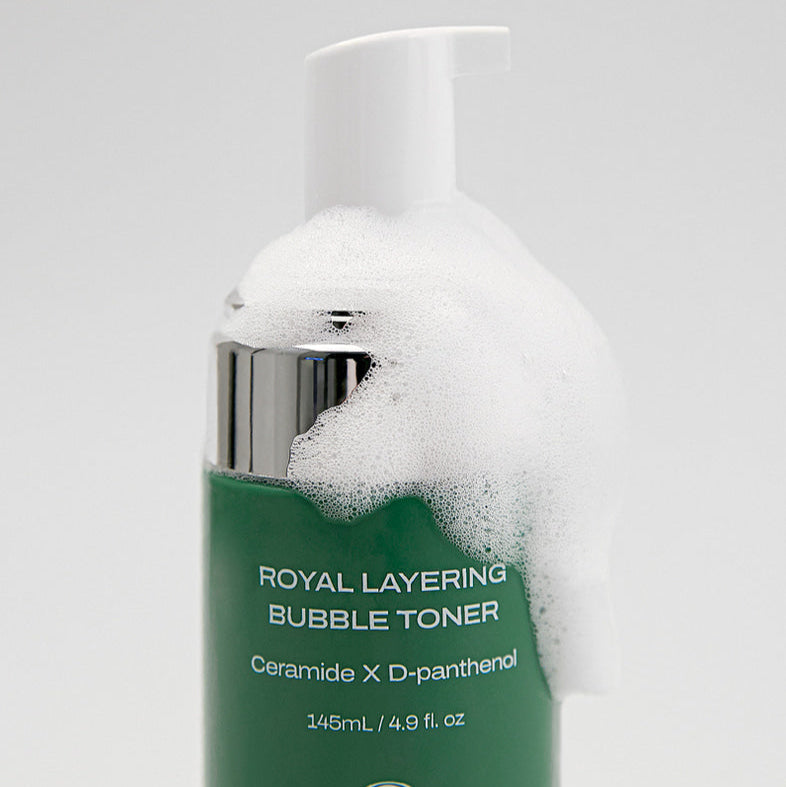 Close-up of HIDIFF Royal Layering Bubble Toner bottle with suds, highlighting its hydrating formula.