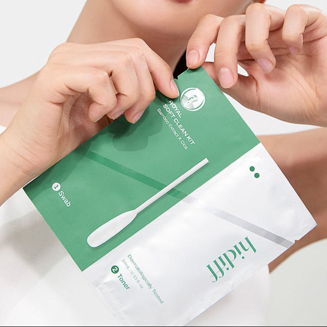 Close-up of a person holding the HIDIFF Royal Soft Clean Kit package with swab