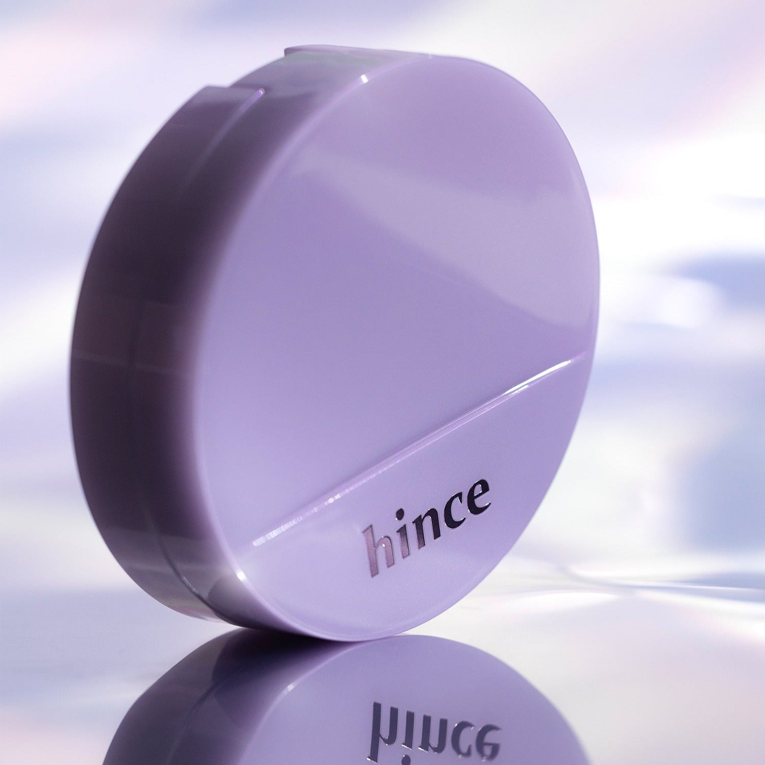 HINCE Second Skin Glow Cushion 12g in sleek lavender case, offering a radiant finish.