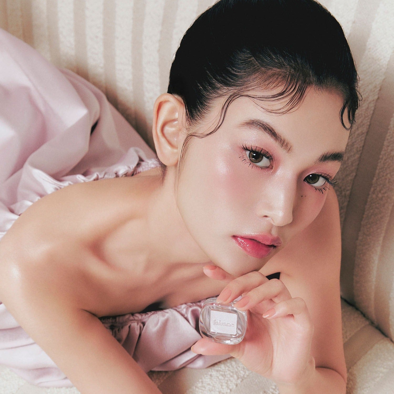 Model showcasing HINCE Single Eyeshadow with soft pink makeup look