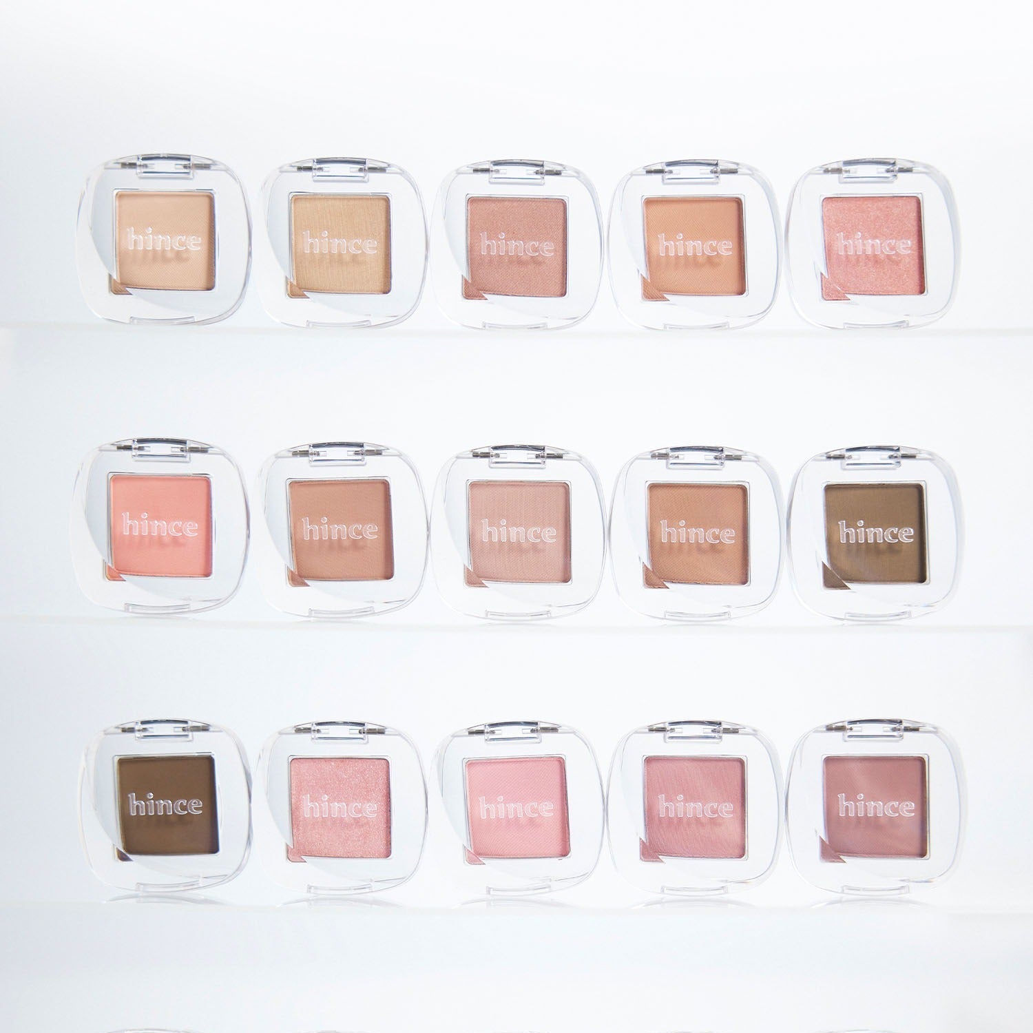 HINCE Single Eyeshadow collection displayed with various shades in individual cases, highlighting the product's vibrant and diverse colors.