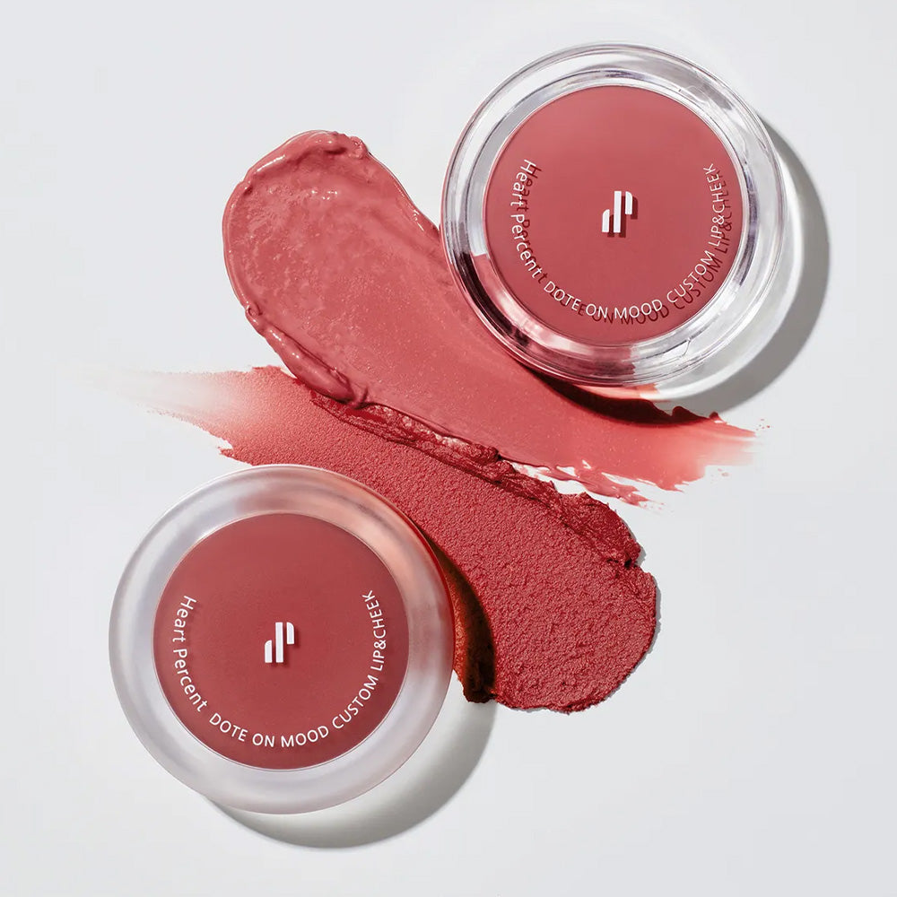 Two shades of HEART PERCENT Dot On Mood Custom Lip & Cheek, featuring smooth, blendable texture, perfect for lips and cheeks.