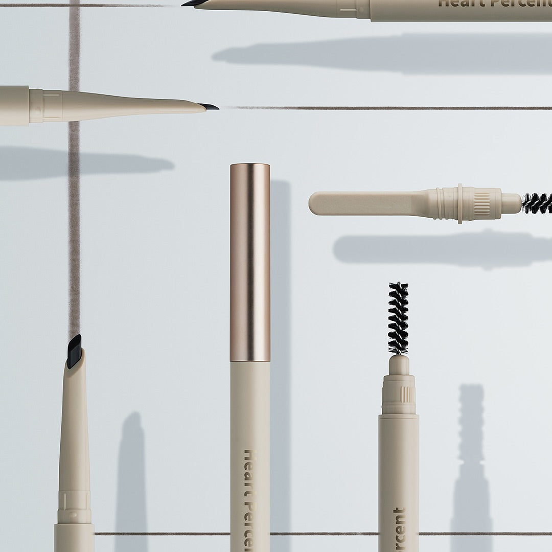 HEART PERCENT Dot On Mood Edge and Flat Eyebrow cosmetic pen and brushes, premium makeup tools arrangement showcasing versatility.