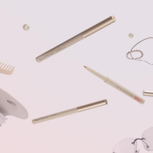 HEART PERCENT Dot On Mood Contour Eyeliner Slim in a stylish flatlay with accessories and pastel background.