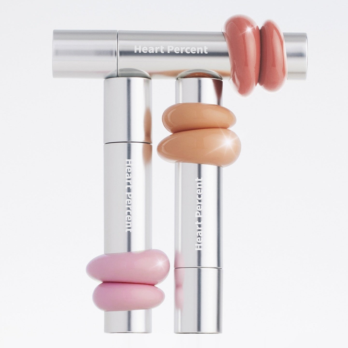 HEART PERCENT Dot On Mood One Way Glow Tint lipstick in stylish silver packaging with colorful accents displayed artistically