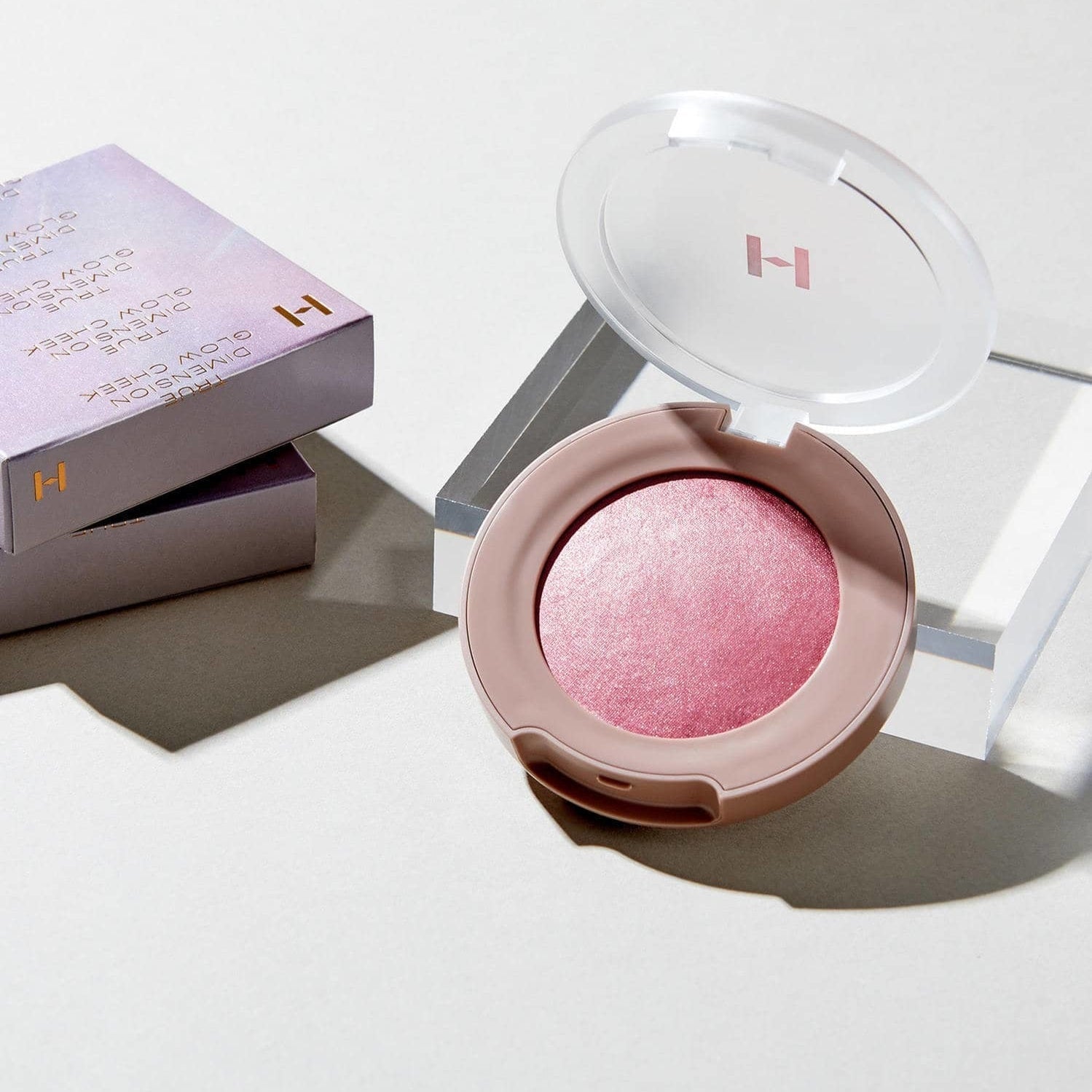 HINCE True Dimension Glow Cheek, radiant pink blush compact for a luminous finish, with packaging.